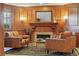 Inviting living area with wood paneled walls, fireplace, and comfortable seating arrangement at 700 N Washington St # 1104, Denver, CO 80203