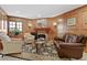 Cozy living room features wood paneled walls, a fireplace and comfortable seating at 700 N Washington St # 1104, Denver, CO 80203