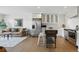 Open living space featuring hardwood floors, stainless steel appliances, and combined living and kitchen at 700 N Washington St # 1104, Denver, CO 80203