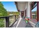 Balcony with chairs and views of surrounding trees and mountains in the distance at 50 Mountain Thunder Dr # 1402, Breckenridge, CO 80424