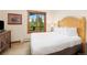 Relaxing bedroom with a plush bed, natural light from a large window, and tasteful decor to create a serene atmosphere at 50 Mountain Thunder Dr # 1402, Breckenridge, CO 80424