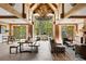 Bright lobby with exposed wood beams, a chandelier, large windows, and ample seating at 50 Mountain Thunder Dr # 1402, Breckenridge, CO 80424