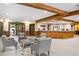 Welcoming hotel lobby with comfortable seating, a wood-paneled reception desk, and tiled floors at 50 Mountain Thunder Dr # 1402, Breckenridge, CO 80424