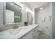 Bright bathroom with double sinks, modern fixtures, and stylish decor at 4640 W Ellsworth Ave, Denver, CO 80219