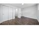 Spacious bedroom with ample closet space, neutral paint colors, and beautiful wood floors at 4640 W Ellsworth Ave, Denver, CO 80219