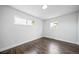Light and airy bedroom with beautiful wood floors and an abundance of natural light at 4640 W Ellsworth Ave, Denver, CO 80219