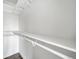 Walk in closet with wooden floors and all-white walls at 4640 W Ellsworth Ave, Denver, CO 80219