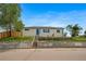 Inviting home exterior with a bright blue front door and a stone retaining wall at 4640 W Ellsworth Ave, Denver, CO 80219