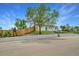 Charming single Gathering home featuring a front lawn and blue front door at 4640 W Ellsworth Ave, Denver, CO 80219