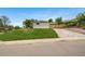 Charming home with well maintained front lawn and extended driveway at 4640 W Ellsworth Ave, Denver, CO 80219