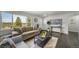 Inviting living space boasts natural light, stylish furnishings, and seamlessly connects to the entryway at 4640 W Ellsworth Ave, Denver, CO 80219