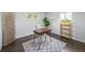 Bright office with dark wood floors and neutral decor perfect for working from home at 4640 W Ellsworth Ave, Denver, CO 80219