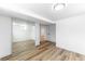 Basement bedroom with mirrored closet and vinyl flooring at 12029 W Dakota Dr, Lakewood, CO 80228