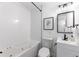 Clean bathroom with a bathtub, toilet, and modern vanity at 12029 W Dakota Dr, Lakewood, CO 80228