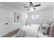 Light and airy bedroom with a queen bed and wood-look flooring at 12029 W Dakota Dr, Lakewood, CO 80228