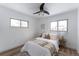 Charming bedroom with a queen bed, ceiling fan, and neutral decor at 12029 W Dakota Dr, Lakewood, CO 80228