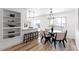 Modern dining area with a round table and neutral color scheme at 12029 W Dakota Dr, Lakewood, CO 80228