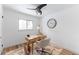 Bright home office features a desk, chair, and large clock at 12029 W Dakota Dr, Lakewood, CO 80228