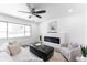 Living room with hardwood floors, fireplace, and ample natural light at 12029 W Dakota Dr, Lakewood, CO 80228