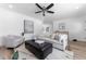 Light and airy living room featuring a comfortable seating area and hardwood floors at 12029 W Dakota Dr, Lakewood, CO 80228