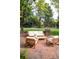 Outdoor patio seating area with comfortable furniture, ideal for relaxing in the serene backyard at 7 Mockingbird Ln, Cherry Hills Village, CO 80113