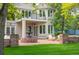 Beautiful backyard featuring a fountain, patio, and lush greenery, creating a peaceful oasis at 7 Mockingbird Ln, Cherry Hills Village, CO 80113