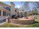 Backyard patio with outdoor seating and mature trees offers a comfortable space for outdoor living at 7 Mockingbird Ln, Cherry Hills Village, CO 80113