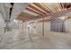 The unfinished basement has concrete floors, exposed ceiling, and support beams at 7 Mockingbird Ln, Cherry Hills Village, CO 80113