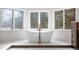 Bathroom featuring freestanding tub, bright windows and tiled flooring at 7 Mockingbird Ln, Cherry Hills Village, CO 80113