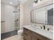 Well-lit bathroom featuring modern fixtures, a glass-enclosed shower, and a stylish vanity at 7 Mockingbird Ln, Cherry Hills Village, CO 80113