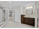 Bathroom with dual access, designer vanity and tile flooring at 7 Mockingbird Ln, Cherry Hills Village, CO 80113
