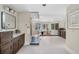 Luxurious bathroom featuring a soaking tub, spacious shower, modern fixtures, and elegant vanity with generous counter space at 7 Mockingbird Ln, Cherry Hills Village, CO 80113