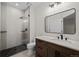 Modern bathroom featuring a glass-enclosed shower and sleek vanity at 7 Mockingbird Ln, Cherry Hills Village, CO 80113