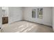 Neutral bedroom with carpet, large window, and ensuite bathroom and closet access at 7 Mockingbird Ln, Cherry Hills Village, CO 80113