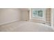 This spacious bedroom features carpet, a window seat, and built-in shelving at 7 Mockingbird Ln, Cherry Hills Village, CO 80113