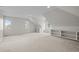 Large bedroom has built-in shelving, carpet, and multiple windows for natural light at 7 Mockingbird Ln, Cherry Hills Village, CO 80113