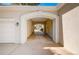 Unique carport with brick archway, providing covered parking and architectural charm at 7 Mockingbird Ln, Cherry Hills Village, CO 80113