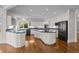 Gourmet kitchen with white cabinetry, granite countertops, and stainless steel appliances at 7 Mockingbird Ln, Cherry Hills Village, CO 80113