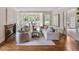 Elegant living room featuring a fireplace, large windows, and a comfortable seating area at 7 Mockingbird Ln, Cherry Hills Village, CO 80113