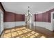 Light-filled living room with hardwood floors and classic chandelier at 7 Mockingbird Ln, Cherry Hills Village, CO 80113