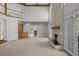 Spacious living area with stone fireplace, wet bar, and ample space for entertaining at 7 Mockingbird Ln, Cherry Hills Village, CO 80113