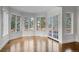 Sunlit living room with hardwood floors and access to the outdoor area at 7 Mockingbird Ln, Cherry Hills Village, CO 80113