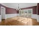 Elegant living room with hardwood floors and views of the landscaped backyard at 7 Mockingbird Ln, Cherry Hills Village, CO 80113