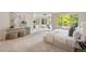 Spacious main bedroom with a cozy fireplace and an abundance of natural light through the bay windows at 7 Mockingbird Ln, Cherry Hills Village, CO 80113