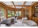 Home office boasts wood trim, custom built-ins, and a lovely view of the backyard at 7 Mockingbird Ln, Cherry Hills Village, CO 80113