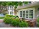 Charming patio area with brick accents and lush greenery, perfect for outdoor seating and relaxation at 7 Mockingbird Ln, Cherry Hills Village, CO 80113