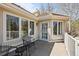 Relaxing outdoor patio with black metal furniture, and bright windows at 7 Mockingbird Ln, Cherry Hills Village, CO 80113