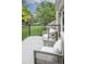 Charming patio with comfortable seating and views of the beautifully landscaped backyard and the neighborhood at 7 Mockingbird Ln, Cherry Hills Village, CO 80113