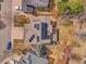 An aerial view showcasing the roof with solar panels, and surrounding neighborhood at 10062 Eagle Valley Way, Highlands Ranch, CO 80129