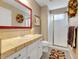 Well-lit bathroom with a vanity, framed mirror, and a walk-in shower, combining functionality and style at 10062 Eagle Valley Way, Highlands Ranch, CO 80129
